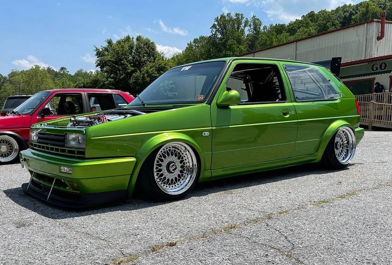 Green Volkswagen MK2 GTI Golf with OptikWerks G60 Plus Kit, front three-quarter view