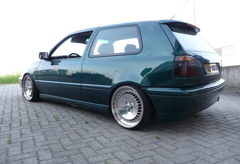 Green Volkswagen MK3 Golf with OptikWerks smoothed ABT style side skirts installed