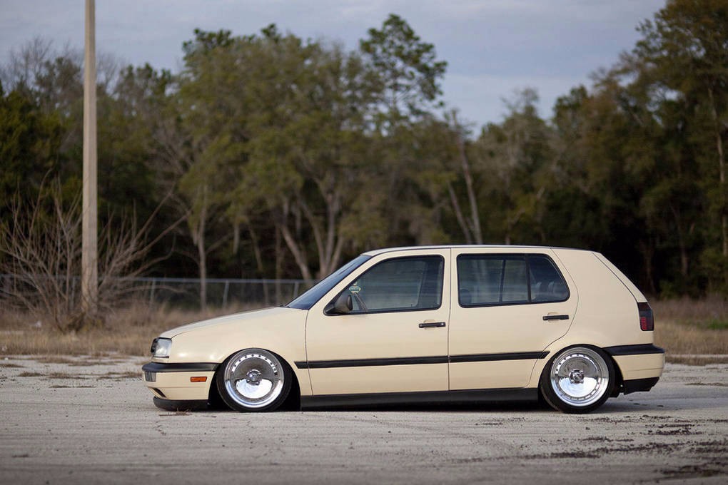 Beige Volkswagen MK3 Golf with textured side skirts