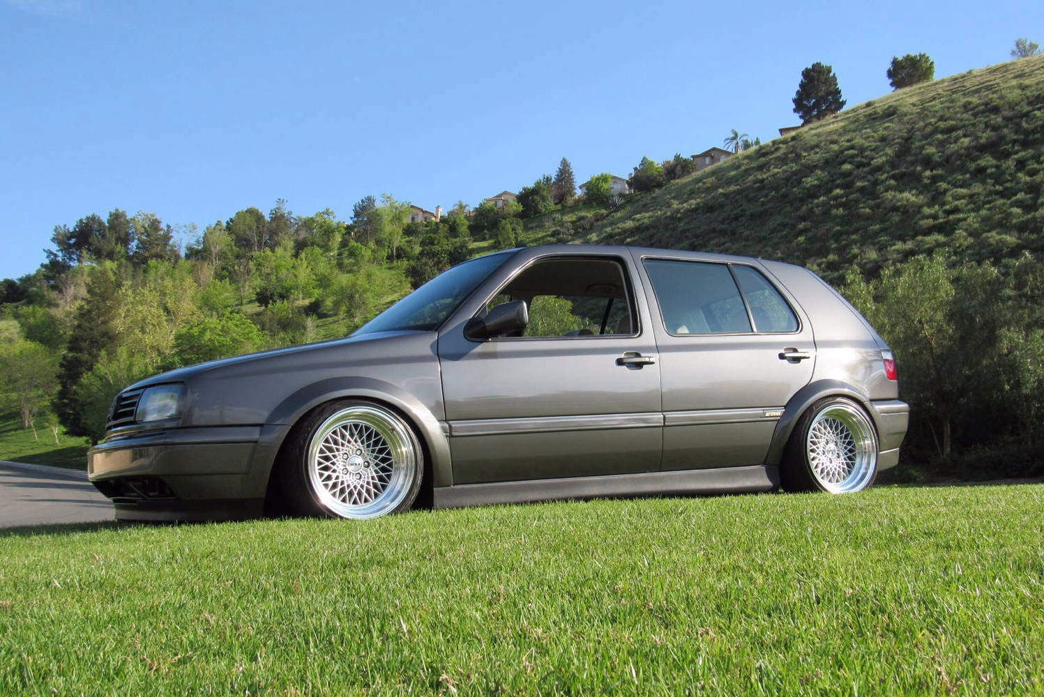 Gray Volkswagen MK3 Golf with ABT textured side skirts