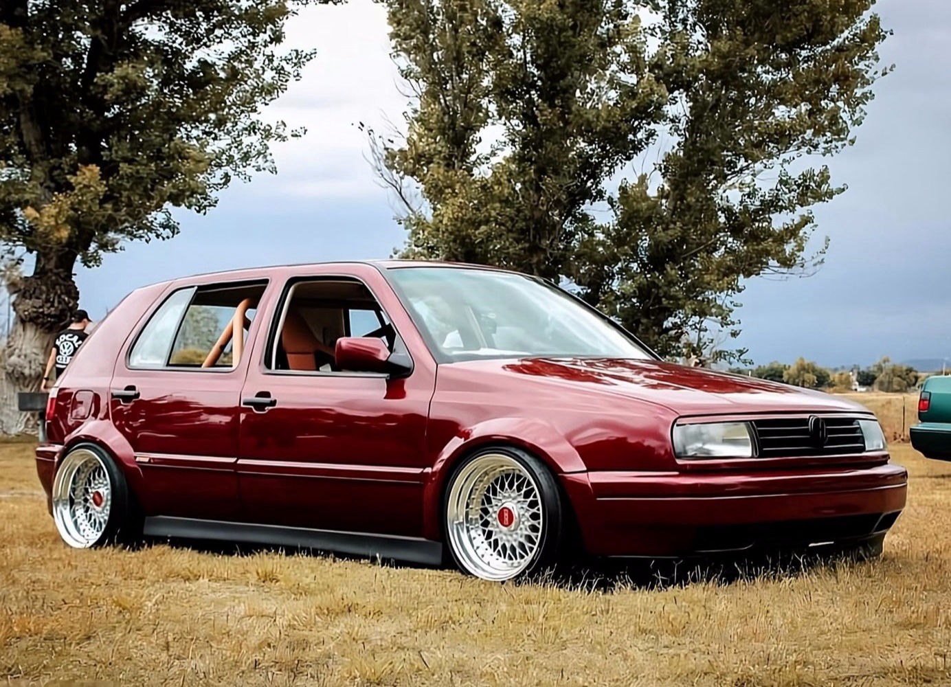 Red Volkswagen MK3 Golf with ABT textured side skirts