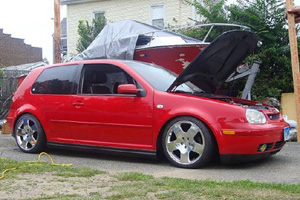 Red Volkswagen MK4 Golf with textured GLI side skirts