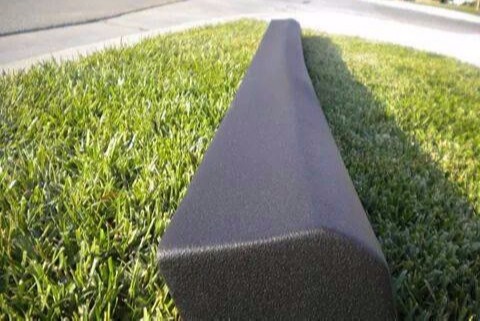 Close-up of textured black MK3 Jetta side skirt