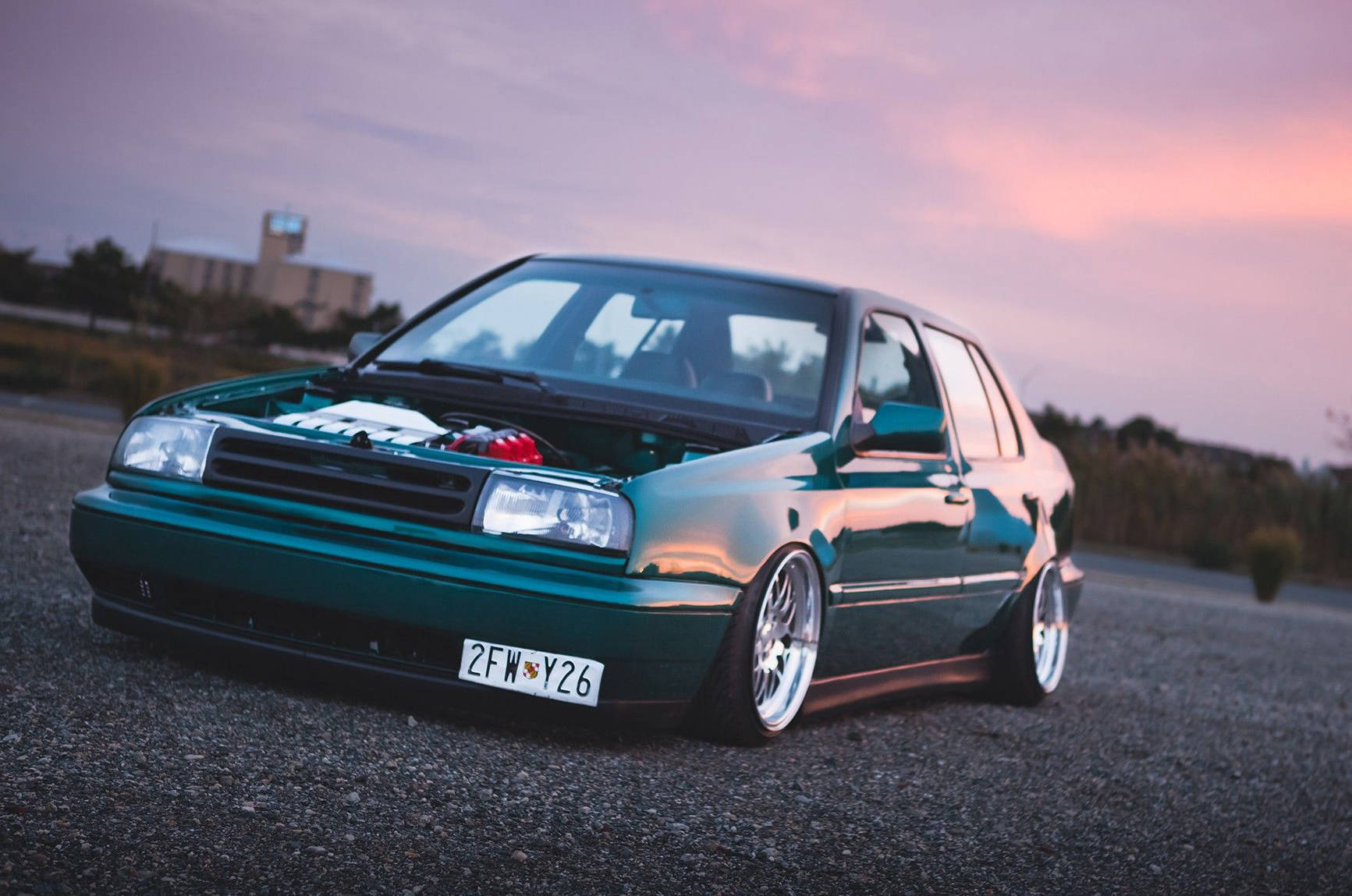 Teal Volkswagen MK3 Jetta with ABT textured side skirts
