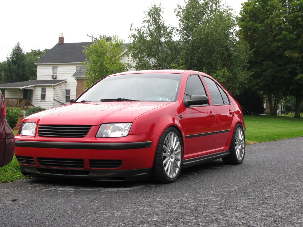 Red VW MK4 Jetta / Bora with textured GLI style side skirts