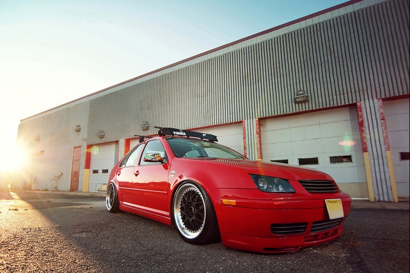 Red Volkswagen MK4 Jetta / Bora platform with Votex style side skirts