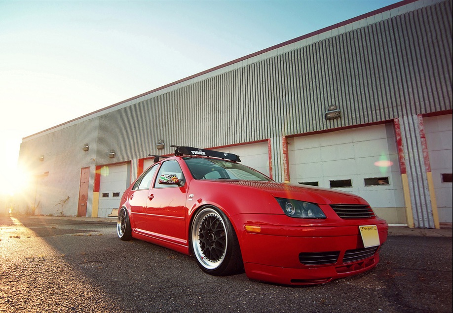 Red Volkswagen MK4 Jetta / Bora platform with Votex style side skirts
