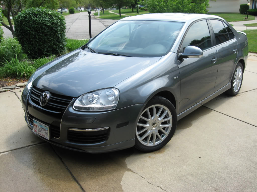 Gray Volkswagen MK5 Jetta front view with Votex style side skirts installed
