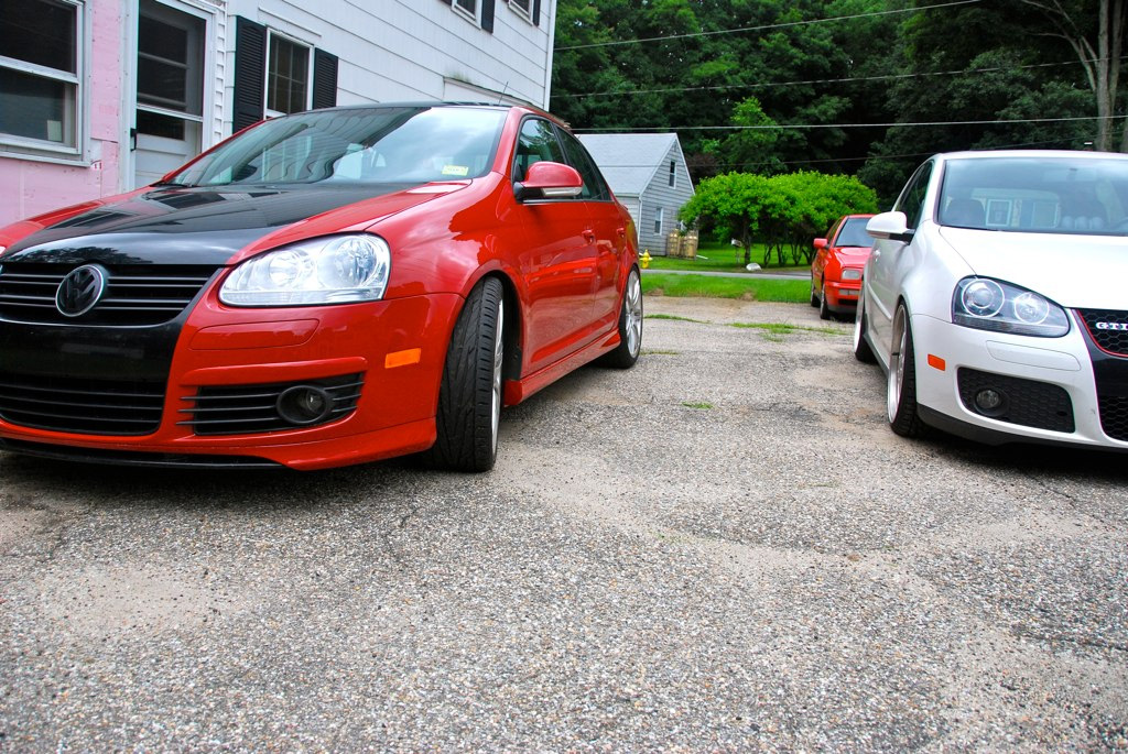 Red Volkswagen MK5 Jetta with OptikWerks Votex side skirts installed