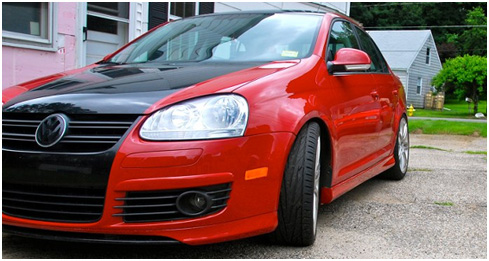Red Volkswagen MK5 Jetta with OptikWerks Votex side skirts installed