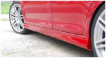 Close-up of MK5 Jetta Votex style side skirt fitment