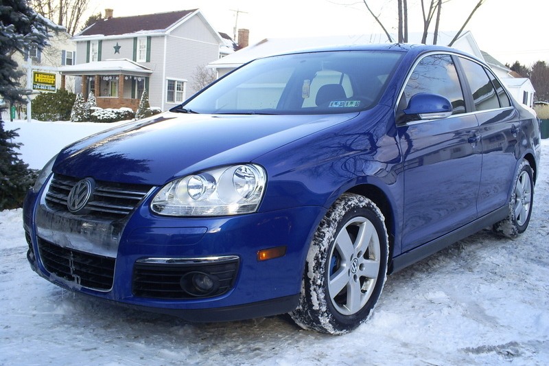 Volkswagen MK5 Jetta with OptikWerks textured Votex style full-length side skirts