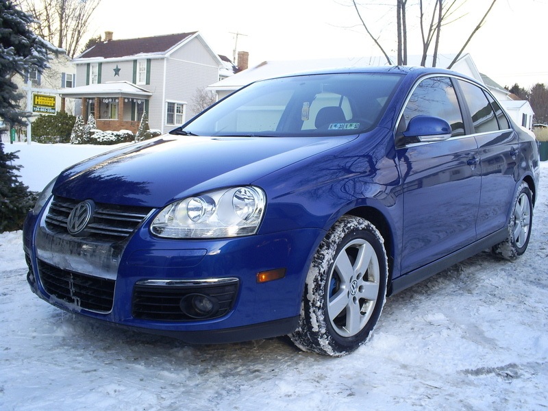 Volkswagen MK5 Jetta with OptikWerks textured Votex style full-length side skirts