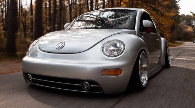 Silver VW New Beetle with Votex style side skirts, front three-quarter view
